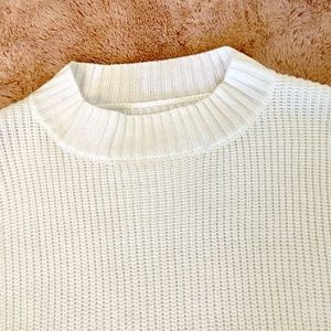 This beautiful white sweater is warm and full of fashion!